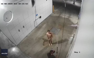 Naked Australian caught on CCTV taking shower in a car wash