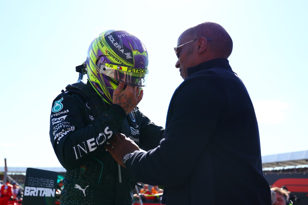NORTHAMPTON, ENGLAND - JULY 07: Race winner Lewis Hamilton of Great Britain and Mercedes celebrates with father Anthony Hamilton in parc ferme during the F1 Grand Prix of Great Britain at Silverstone Circuit on July 07, 2024 in Northampton, England. (Photo by Bryn Lennon - Formula 1/Formula 1 via Getty Images)
