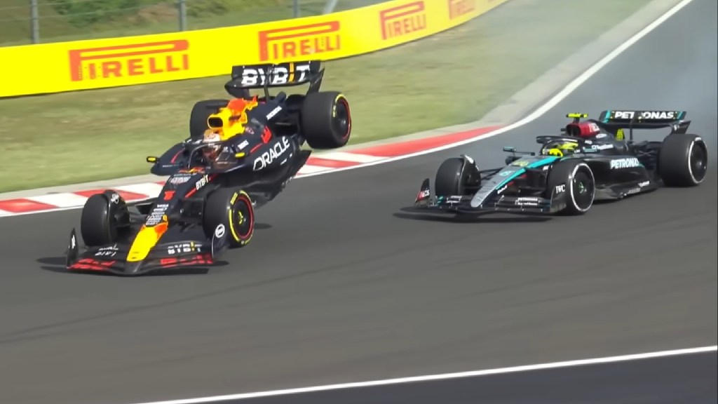 Max Verstappen's Red Bull RAcing F1 car flies into the air after making contact with Lewis Hamilton on lap 63 of the 2024 Hungarian GP.