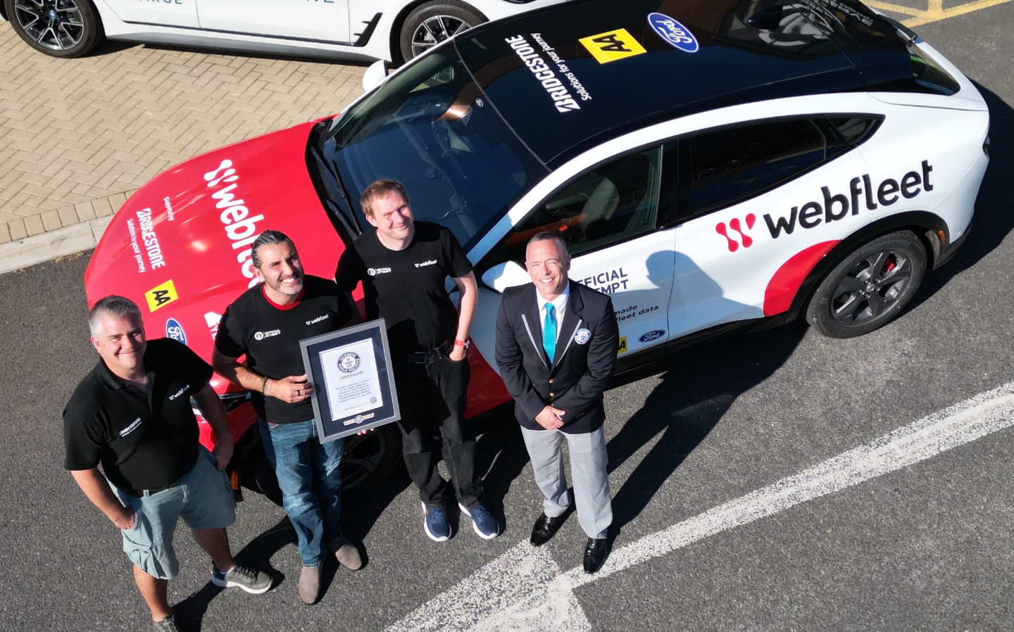 Kevin Booker and Sam Clarke with the record-breaking Ford Mustang Mach-E.