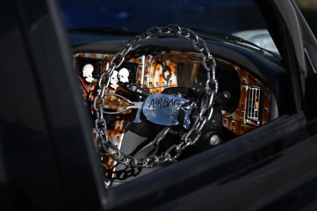 A small bag of air is affixed to the steering wheel of a modified car on display at 'The Speed Show' held at Elvington Airfield, near York, northern England on February 24, 2024. The Speed Show, hosted by 'Straightliners' takes place on February 24th and 25th and features 200 vehicles on display as well as drag racing and performance car displays. (Photo by Oli SCARFF / AFP) (Photo by OLI SCARFF/AFP via Getty Images)