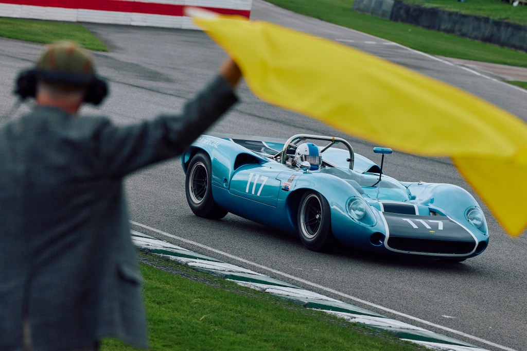 The Lola-Chevrolet T70 Spyder sports prototype of Ian Simmonds passes one of many yellow flags during the rain-affected weekend. Photo: Benjamin Cremel/ AFP via Getty Images