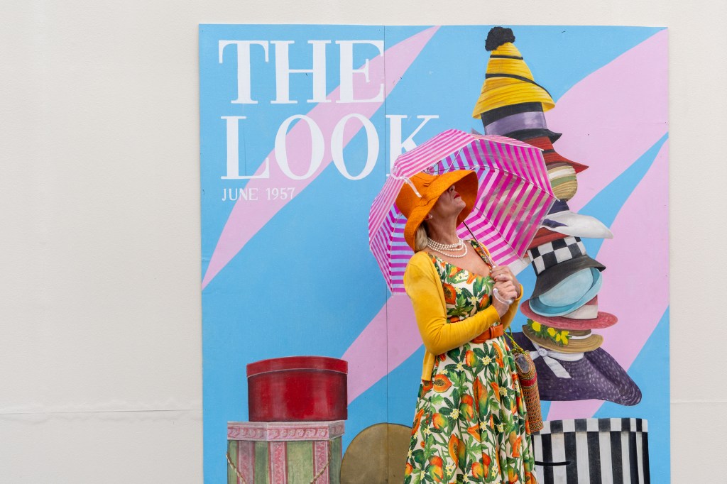 A wary festival-goer checks the skies. Photo: Tristan Fewings via Getty Images