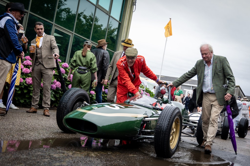 The 1961 Lotus-Climax 21 of Alex Morton, which took part in the Glover Trophy for 1.5-litre Grand Prix cars, is wheeled through the paddock. Photo: Tristan Fewings via Getty Images