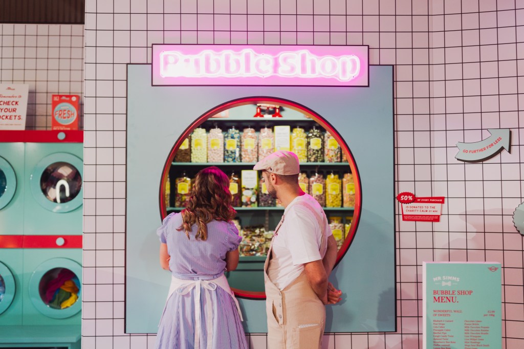 Visitors at Earls Court Motor Show take a looks at one of the exhibits. Photo: Toby Whales for Goodwood.