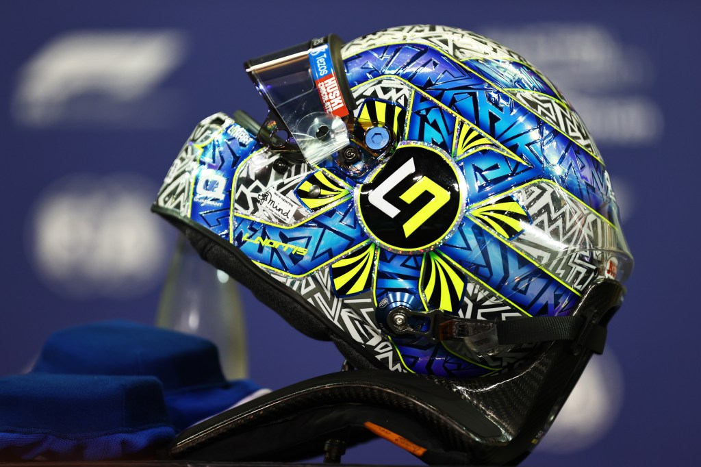 ABU DHABI, UNITED ARAB EMIRATES - DECEMBER 11: The helmet of Lando Norris of Great Britain and McLaren F1 is pictured in the garage during qualifying ahead of the F1 Grand Prix of Abu Dhabi at Yas Marina Circuit on December 11, 2021 in Abu Dhabi, United Arab Emirates. (Photo by Mark Thompson/Getty Images)