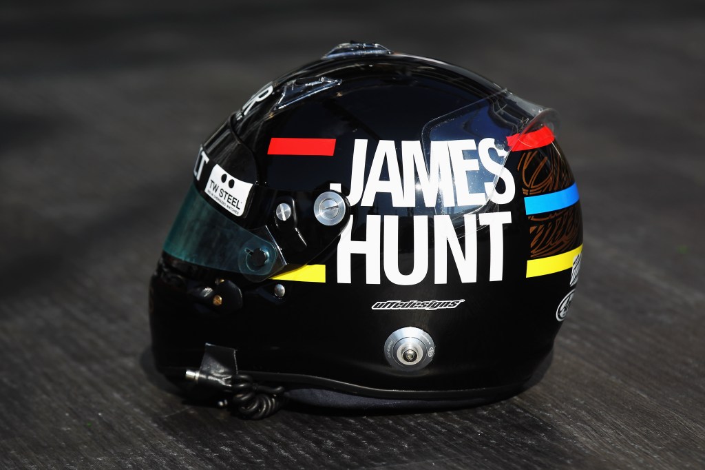 MONTE CARLO, MONACO - MAY 24:  Kimi Raikkonen of Finland and Lotus displays a specially designed drivers helmet featuring a tribute to the late F1 World Champion James Hunt following practice for the Monaco Formula One Grand Prix at the Monte Carlo Circuit on May 24, 2012 in Monte Carlo, Monaco.  (Photo by Mark Thompson/Getty Images)