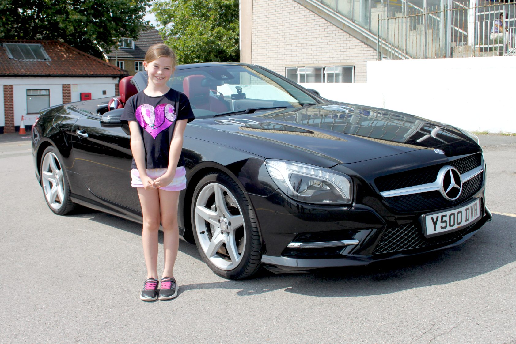 Eva Dron poses next to a Mercedes SL500 at Young Driver, Kempton Park