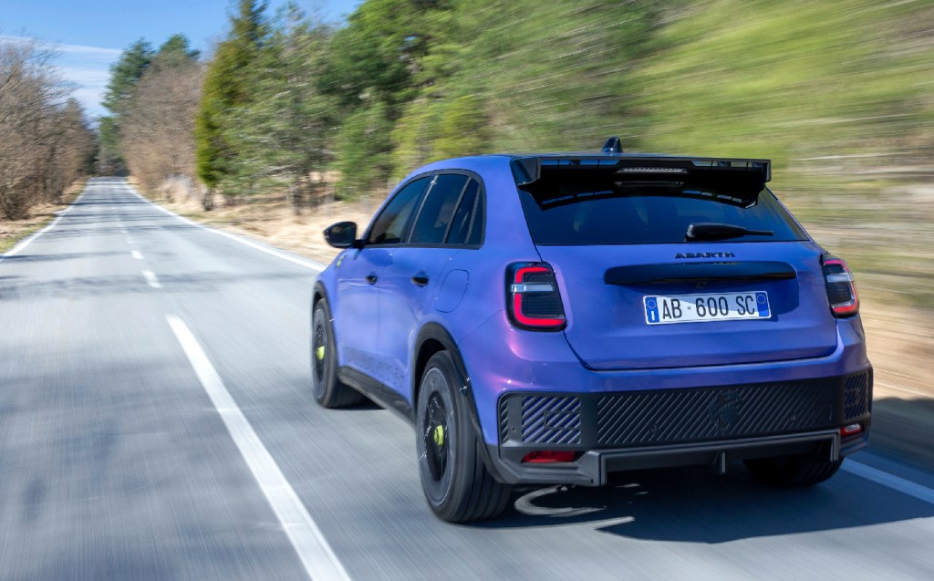 Abarth 600e on road (rear view)