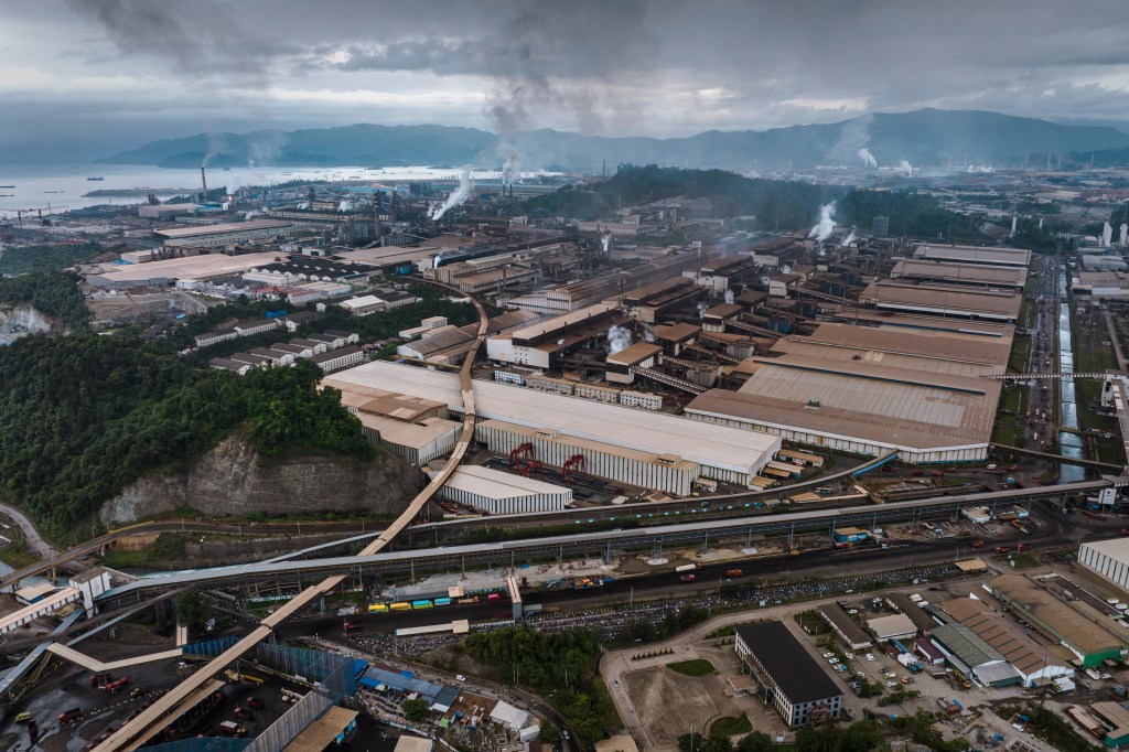 MOROWALI, CENTRAL SULAWESI, INDONESIA - AUGUST 02: In this aerial view -  A view of Indonesia Morowali Industrial Park (IMIP), that consists of around 77,000 local workers and around 6,000 Chinese workers on August 2, 2023 in Morowali, Central Sulawesi, Indonesia. The global demand for the raw material nickel, a key component in batteries - especially those used in electric vehicles (EVs) - is growing rapidly. Estimates from the U.S. Geological Survey (USGS) showed that global nickel production grew 21% in 2022 alone. Indonesia holds the world's largest nickel reserves and leverages those reserves to attract investment in the battery supply chain, a report by the Center for Strategic and International Studies said. The batteries needed for electric vehicles will see demand for nickel outstrip demand from other industries, such as steel production, by 2030. Indonesia alone will account for roughly half of global nickel supply growth through to 2025. The success of the country's refining projects is a key determinant of both supply and nickel prices for the global market. As of 2020, Indonesia has 292 nickel mining permits, mostly in Sulawesi, as the island hosts most of the national nickel reserves, the same CSIS report said. Central Sulawesi Province is home to the Indonesia Morowali Industrial Park (IMIP), an integrated nickel hub for steel production, where a supply chain for battery production is planned. (Photo by Ulet Ifansasti/Getty Images)