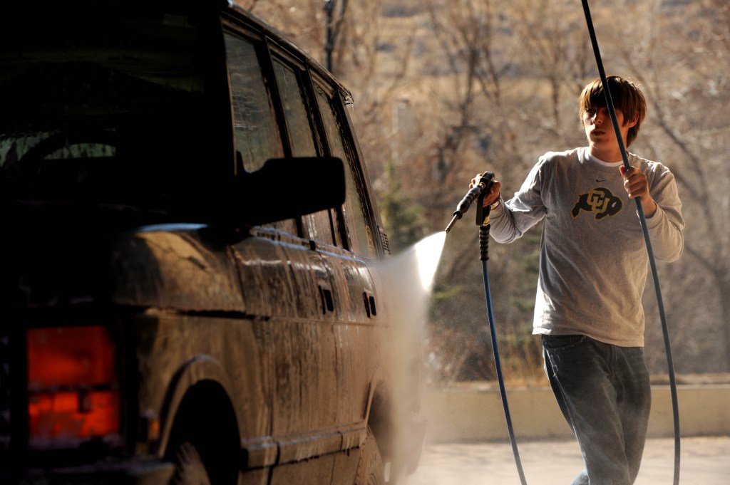 A young man washes his Range Rover. Helen H. Richardson/The Denver Post  (Photo By Helen H. Richardson/The Denver Post via Getty Images)