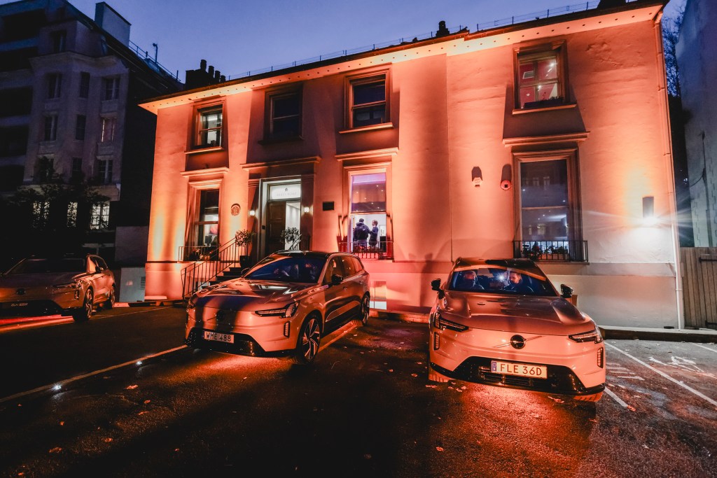 Three Volvo EX90 cars outside the Abbey Road studios