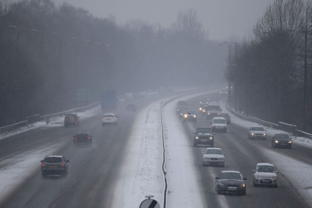 Motorists travel in snowy conditions along the M3 motorway in southern England on March 2, 2018. - Britain -- and most of Europe -- has been gripped by extreme cold weather and major snowfall throughout the week. (Photo by Daniel LEAL / AFP) (Photo by DANIEL LEAL/AFP via Getty Images)